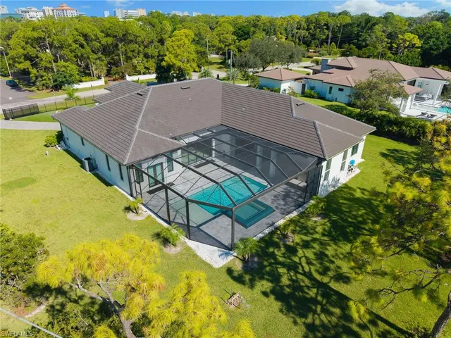 an aerial view of a house having swimming pool