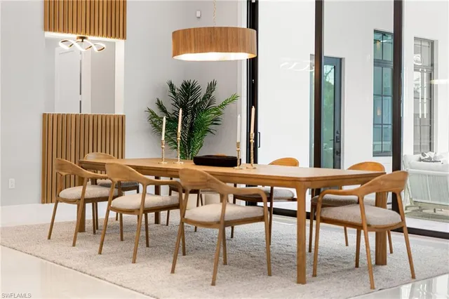 a dining room with furniture and window