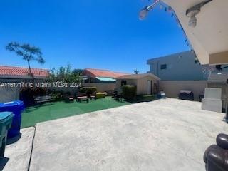 2752 Southwest 3rd Street Miami, FL 33135 - Photo 18 of 21 a view of a house with a yard and a car park
