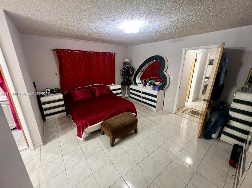2752 Southwest 3rd Street Miami, FL 33135 - Photo 8 of 21 a bedroom with furniture and a rug