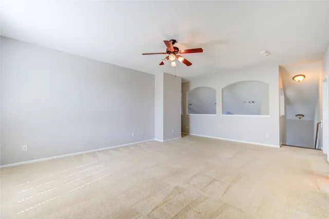 a view of a big room with carpet
