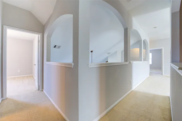 a view of a hallway to a bedroom