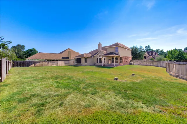 a view of a house with a garden and deck