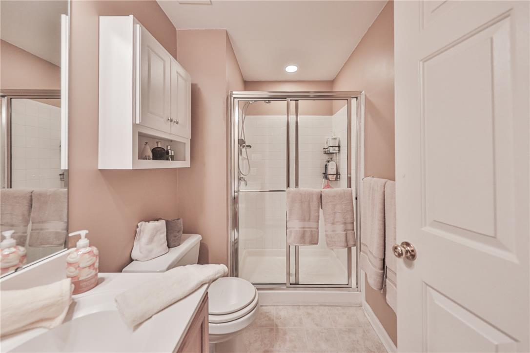 138 Clover Hollow Road Easton, PA 18045 - Photo 74 of 95 A compact and functional bathroom features a clear glass shower enclosure and bright overhead lighting.