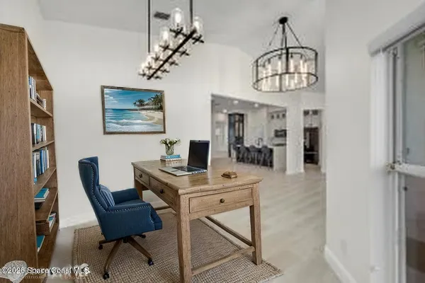 a large kitchen with a table and chairs