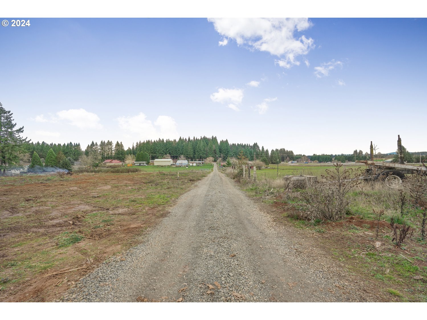 33166 Southeast Kelso Road Boring, OR 97009 - Photo 20 of 20 a view of a dry yard with trees in the background
