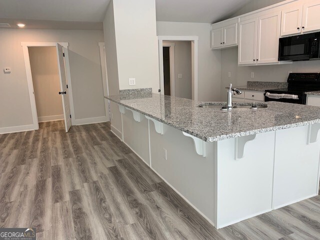 465 Riley Circle Northwest Milledgeville, GA 31061 - Photo 2 of 9 a kitchen with appliances a sink and cabinets