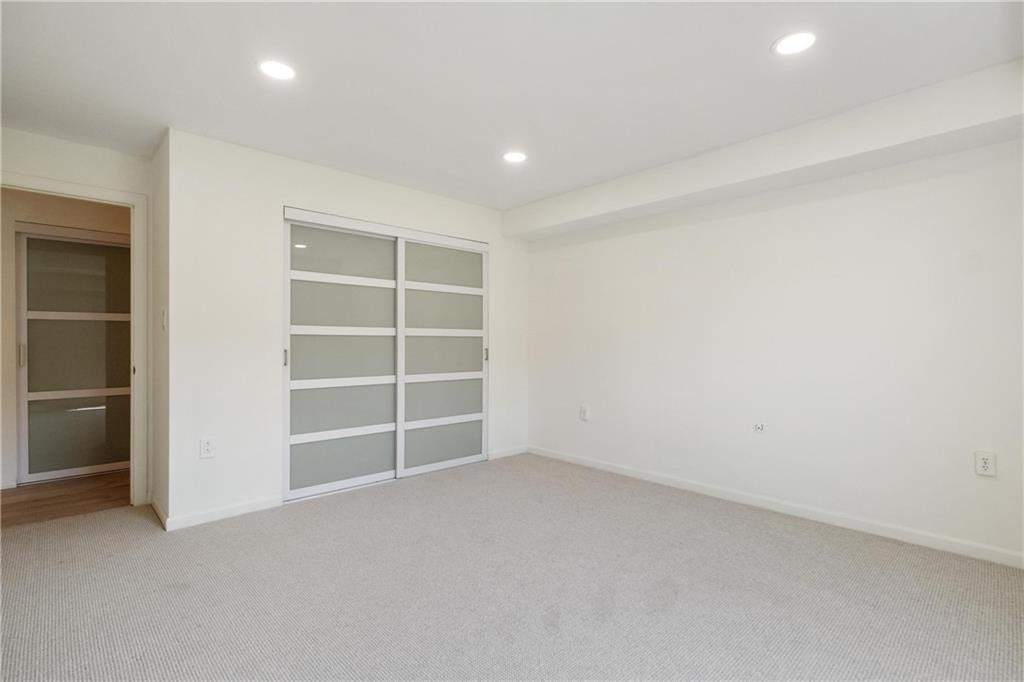 300 Fox Chapel Road, Unit 515 Pittsburgh, PA 15238 - Photo 17 of 35 Guest bedroom with frosted glass panel closet doors.