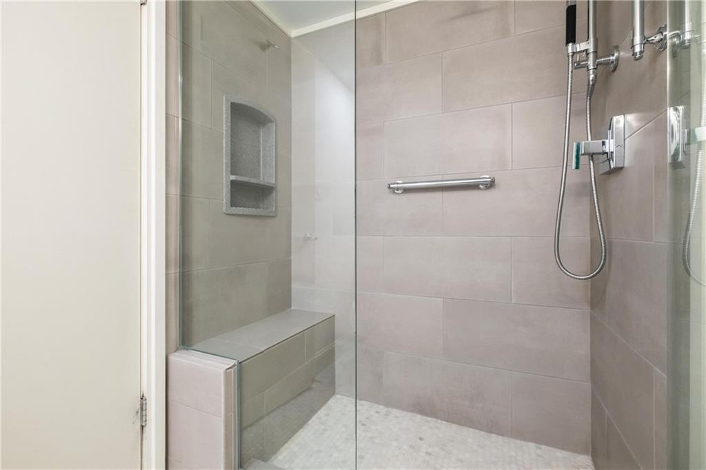 300 Fox Chapel Road, Unit 515 Pittsburgh, PA 15238 - Photo 22 of 35 Ceramic tile Walk~in shower with bench and custom glass door and rain shower.