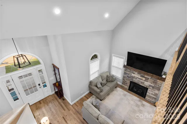 a view of a hallway with a ceiling fan