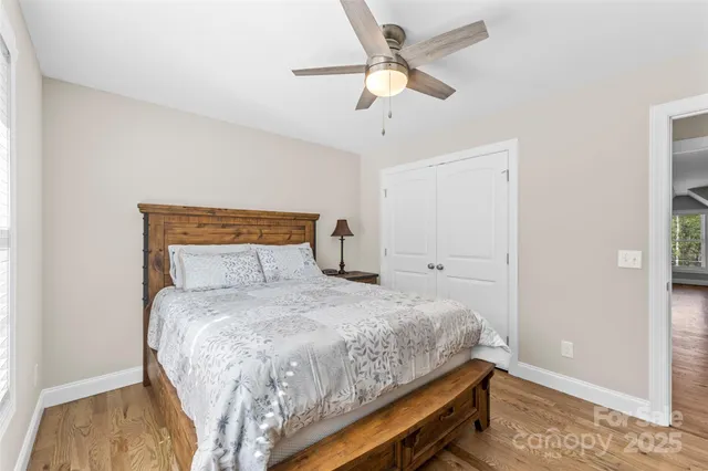 a bedroom with a bed and a desk