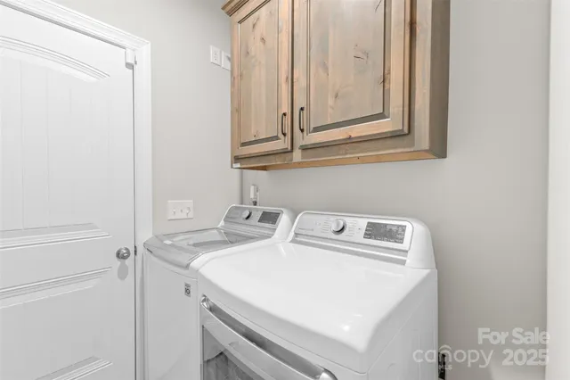 a view of swimming pool with a lounge chairs