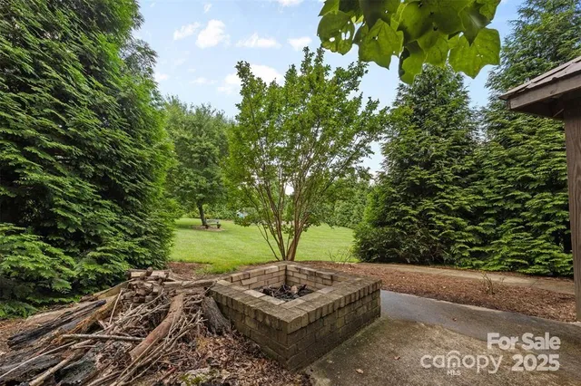 a view of a house with a yard and garage