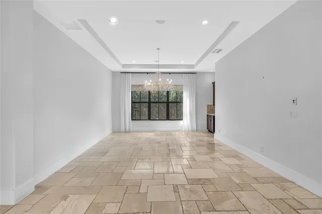 a kitchen with stainless steel appliances granite countertop a sink a oven and a refrigerator