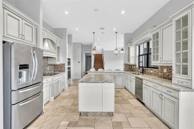 a view of a balcony with furniture and a floor to ceiling window