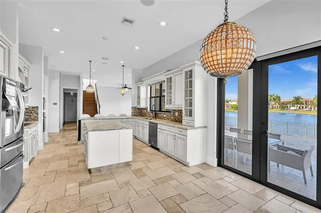 a view of a swimming pool with a lounge chair