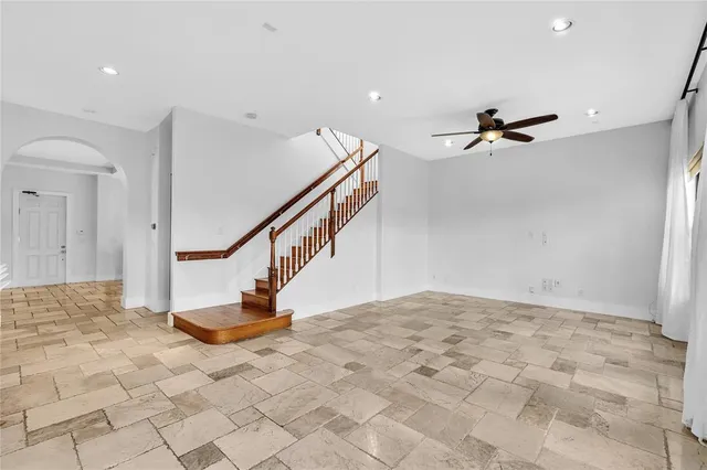 a bedroom with a bed and a lamp