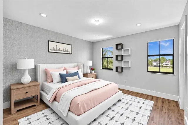 an empty room with wooden floor and closet