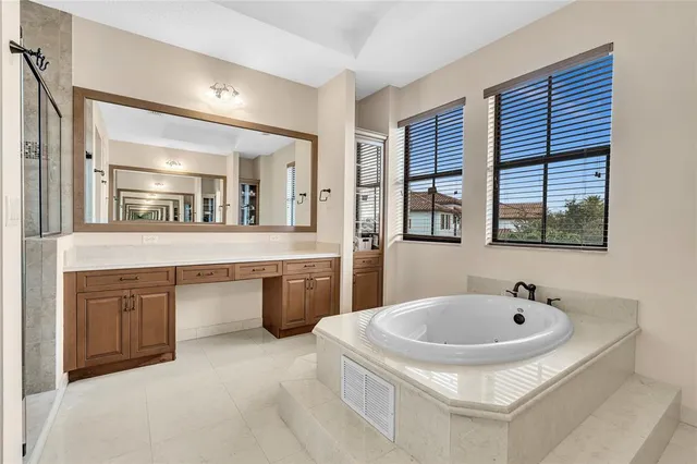 an aerial view of residential houses with outdoor space and river