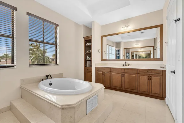 an aerial view of a house with a lake view