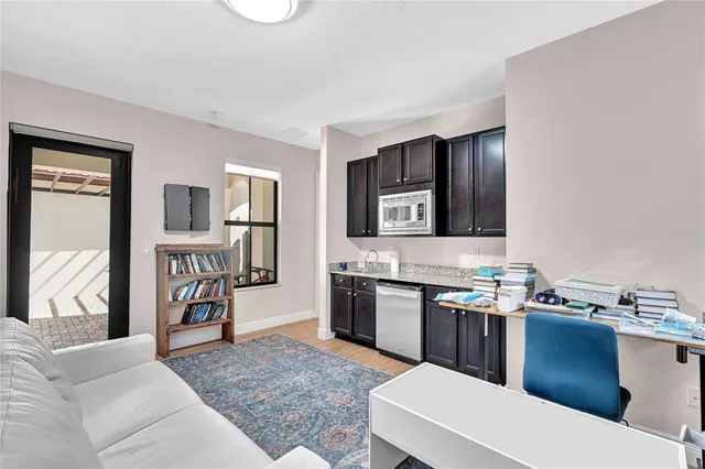 a bathroom with a toilet a sink and a window