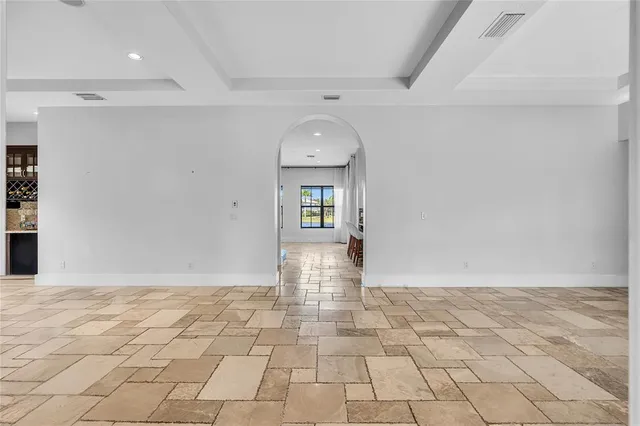 a view of an empty room and glass door