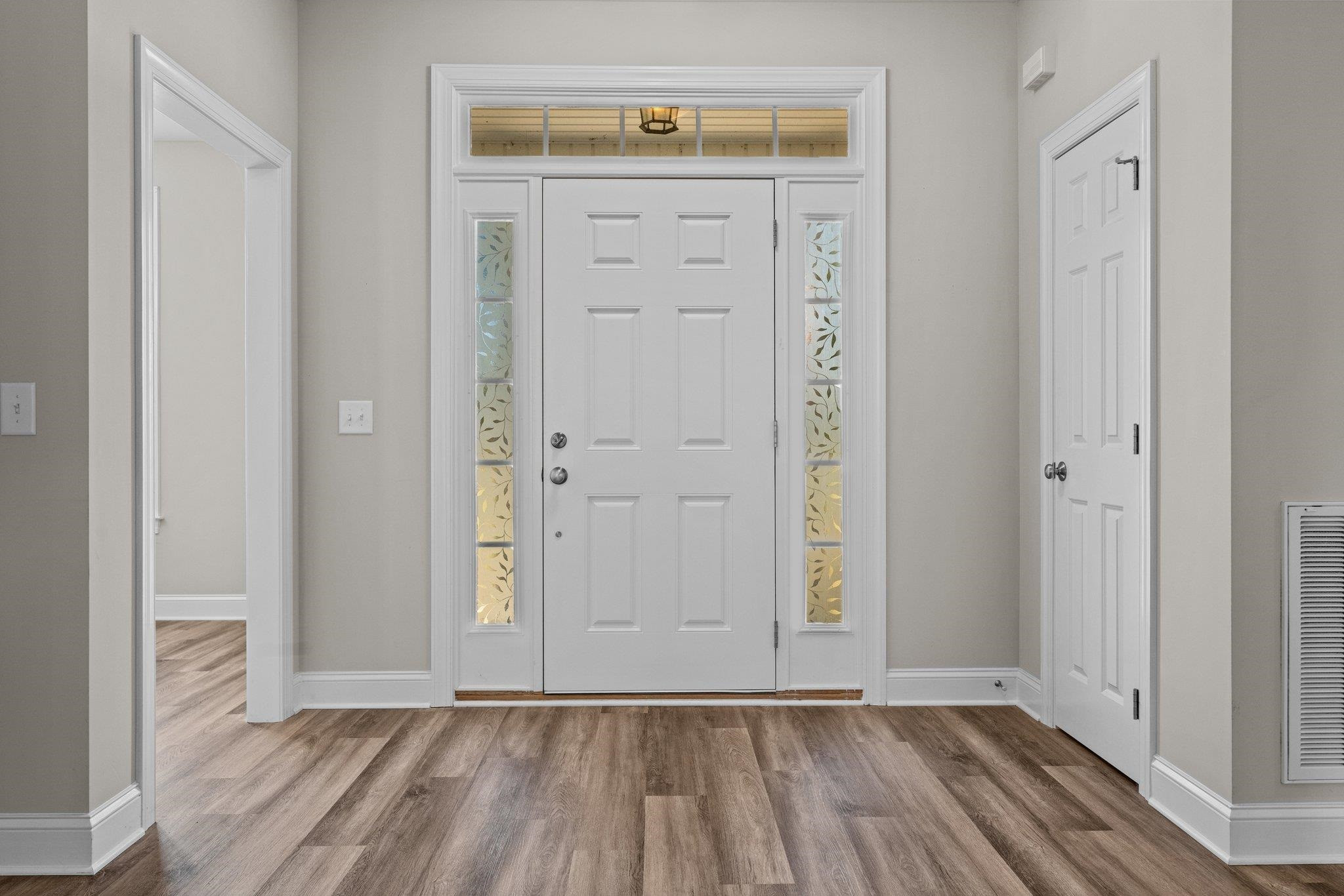 991 Sheriff Johnson Road Lillington, NC 27546 - Photo 17 of 52 an empty room with wooden floor closet and windows