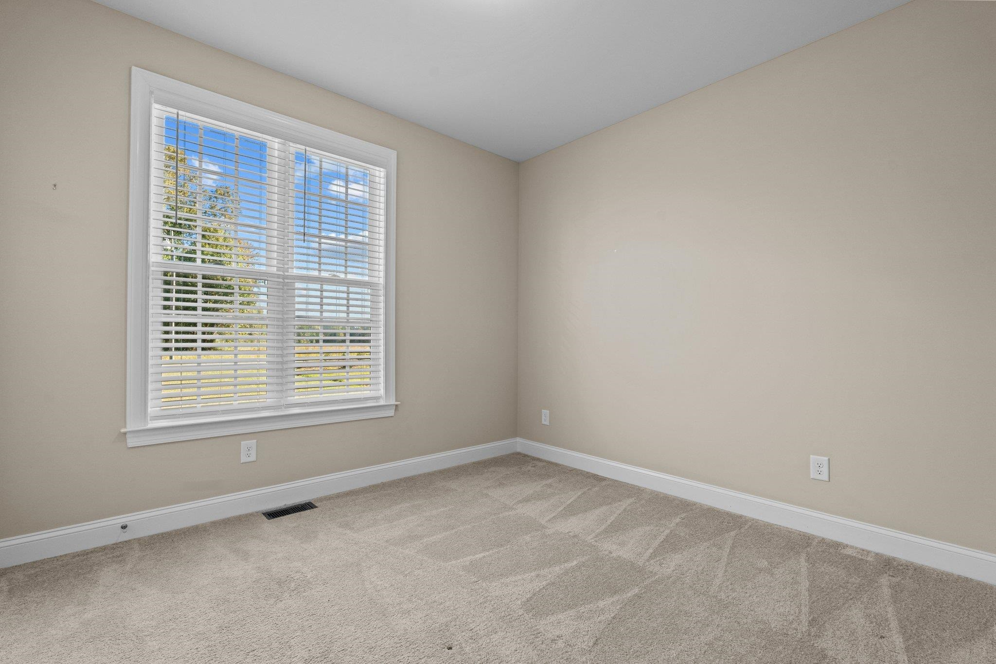 991 Sheriff Johnson Road Lillington, NC 27546 - Photo 19 of 52 an empty room with a window