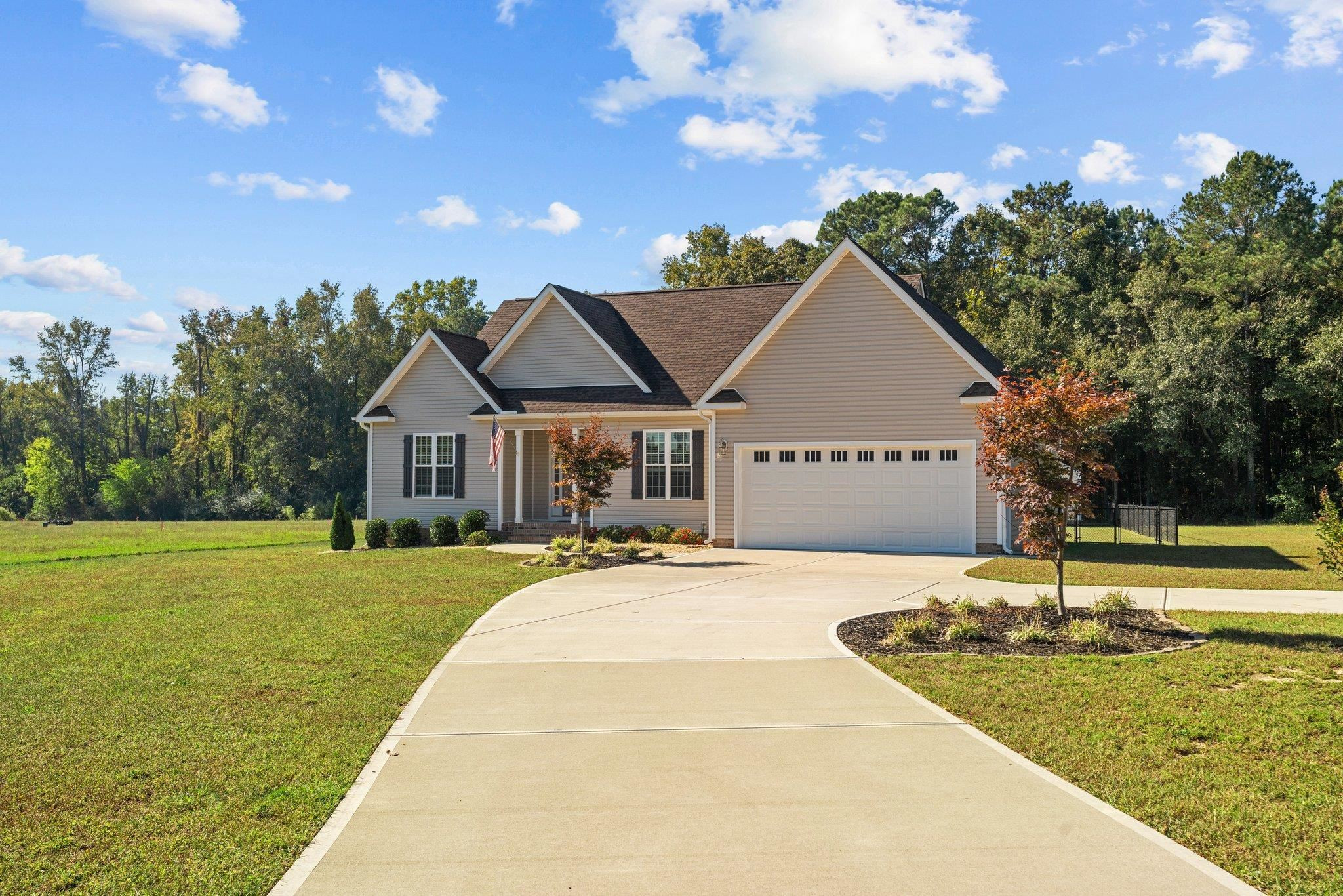 991 Sheriff Johnson Road Lillington, NC 27546 - Photo 2 of 52 a front view of a house with garden