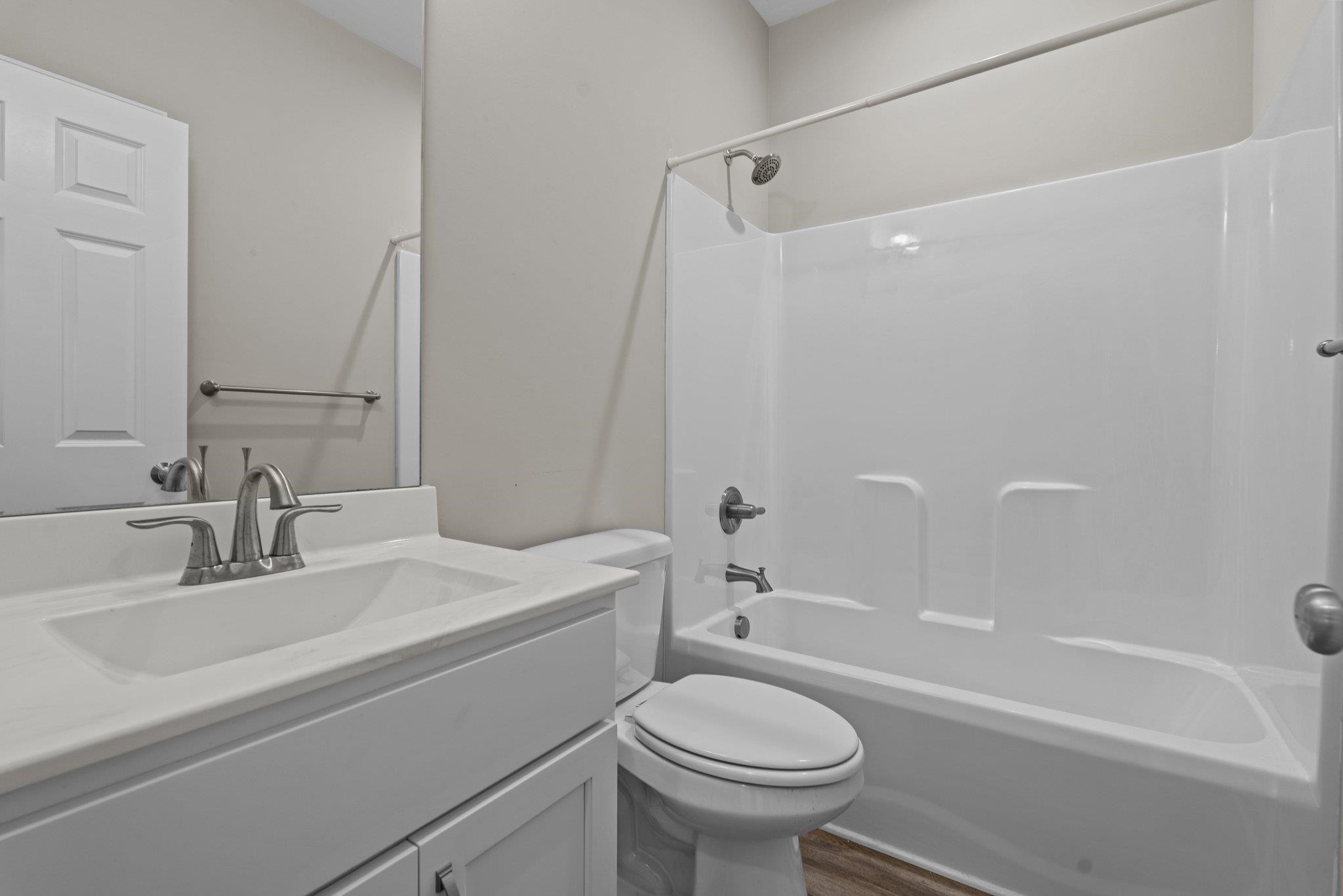 991 Sheriff Johnson Road Lillington, NC 27546 - Photo 21 of 52 a bathroom with a sink a toilet and a bathtub