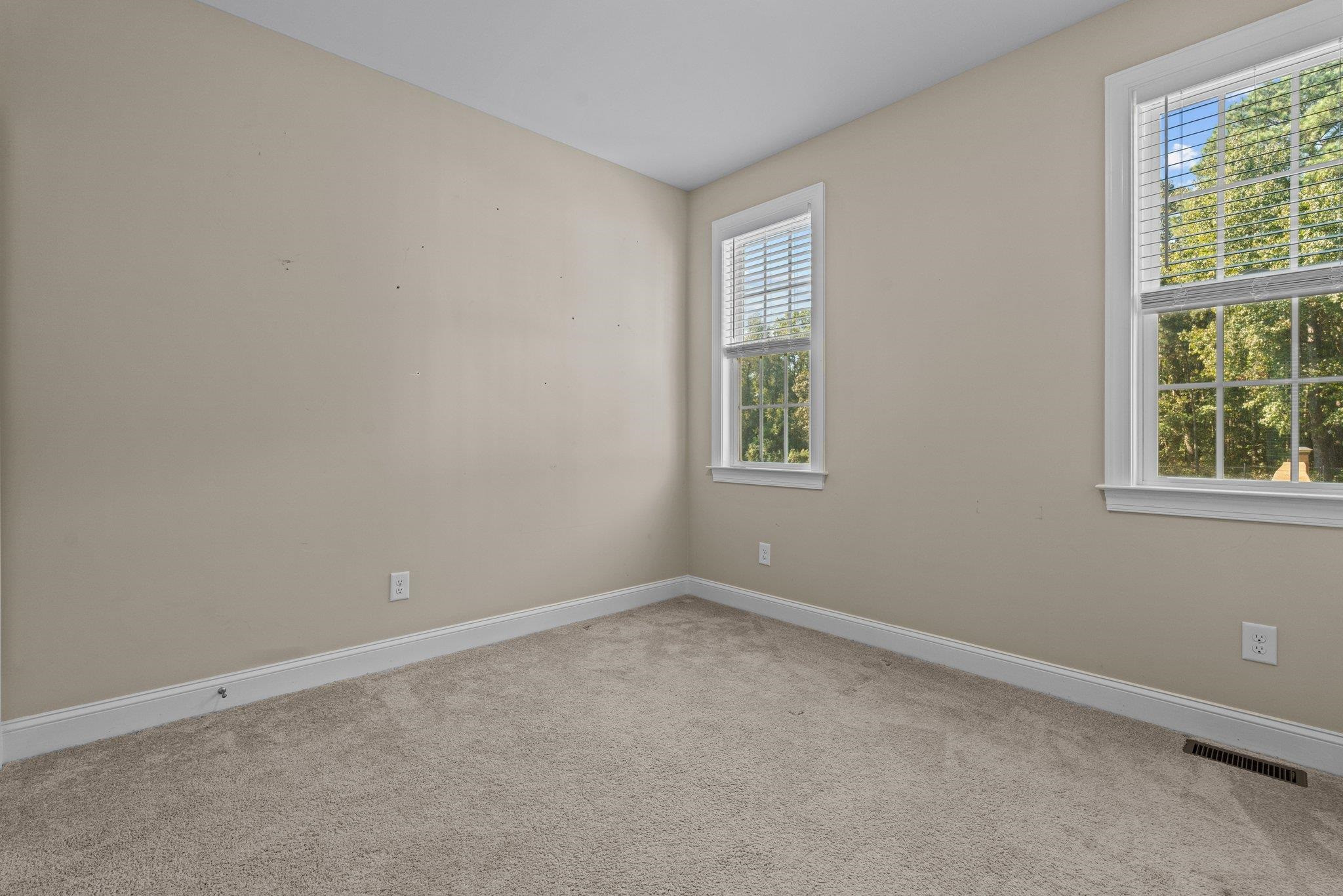 991 Sheriff Johnson Road Lillington, NC 27546 - Photo 22 of 52 an empty room with a window