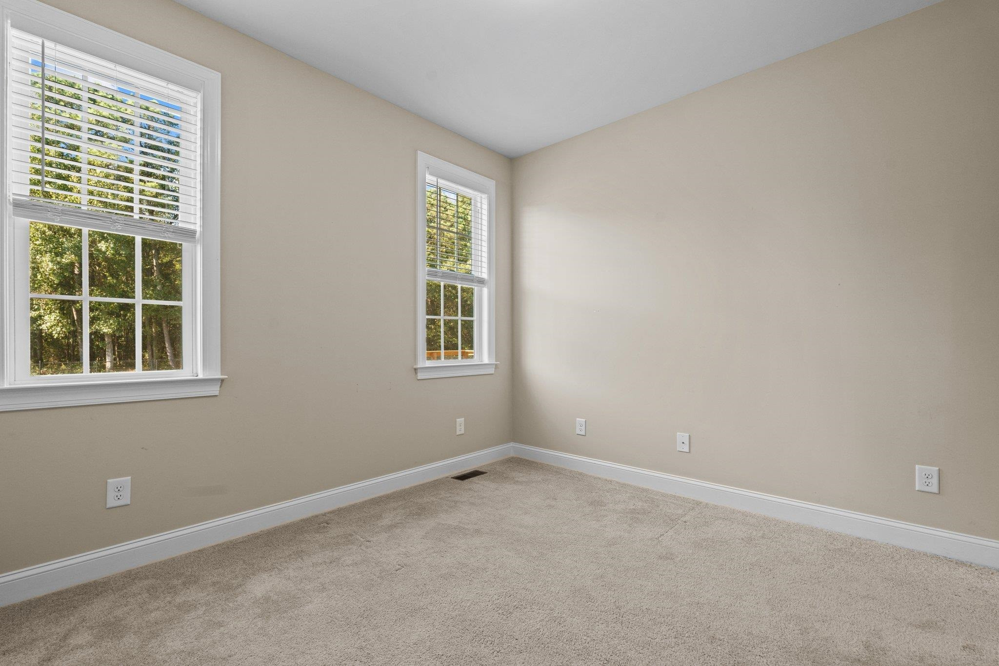 991 Sheriff Johnson Road Lillington, NC 27546 - Photo 23 of 52 an empty room with windows