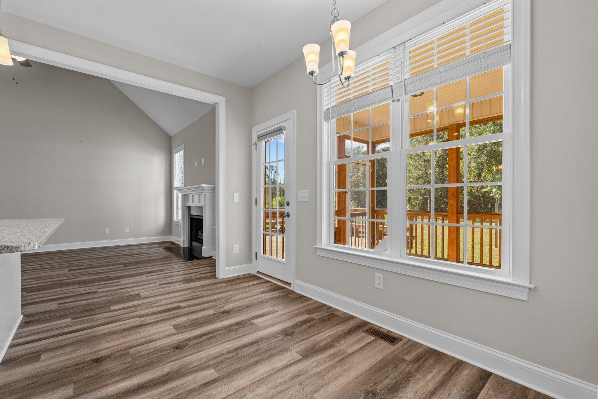 991 Sheriff Johnson Road Lillington, NC 27546 - Photo 26 of 52 a view of an empty room with wooden floor and a window