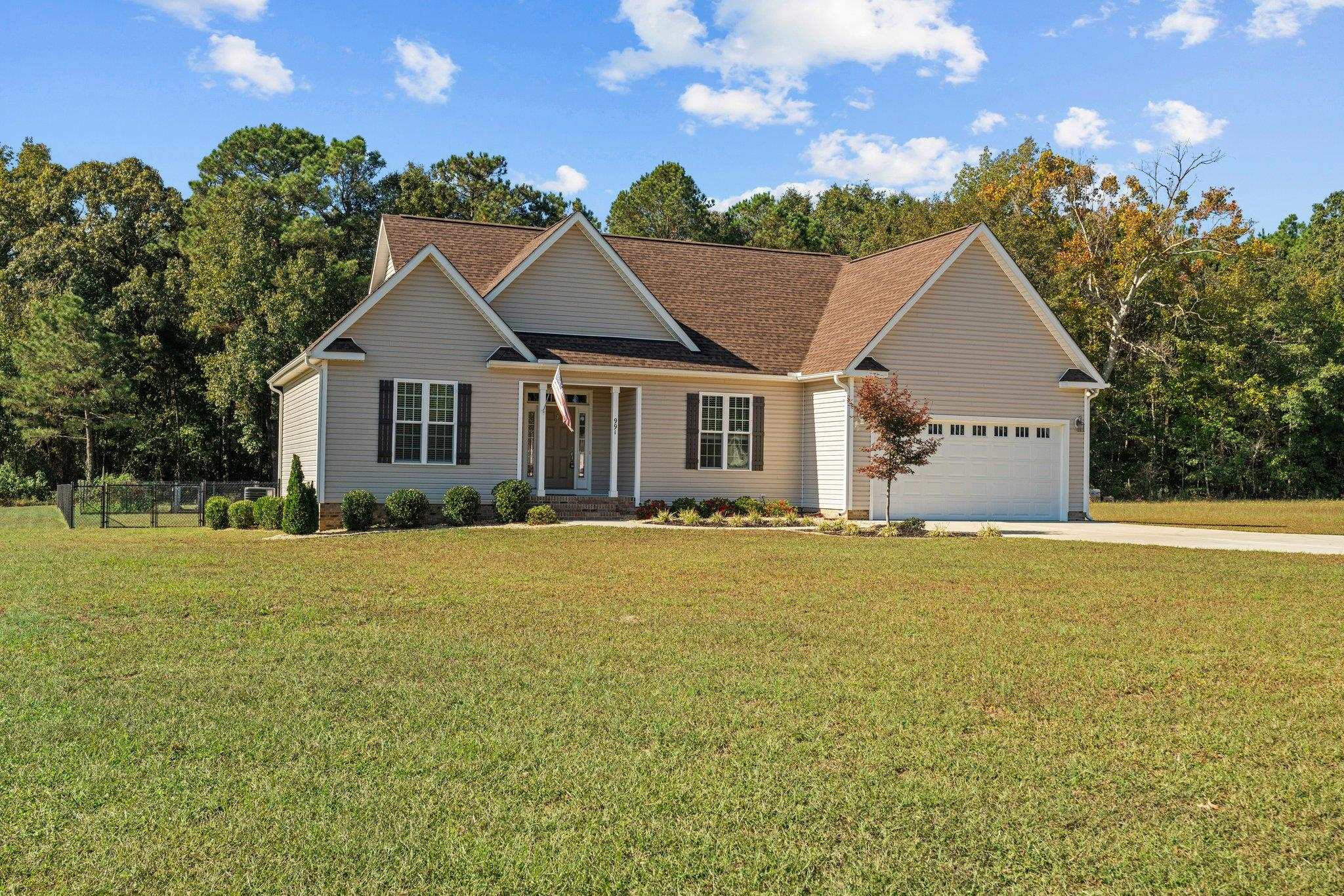 991 Sheriff Johnson Road Lillington, NC 27546 - Photo 3 of 52 a view of a house with a outdoor space and street view