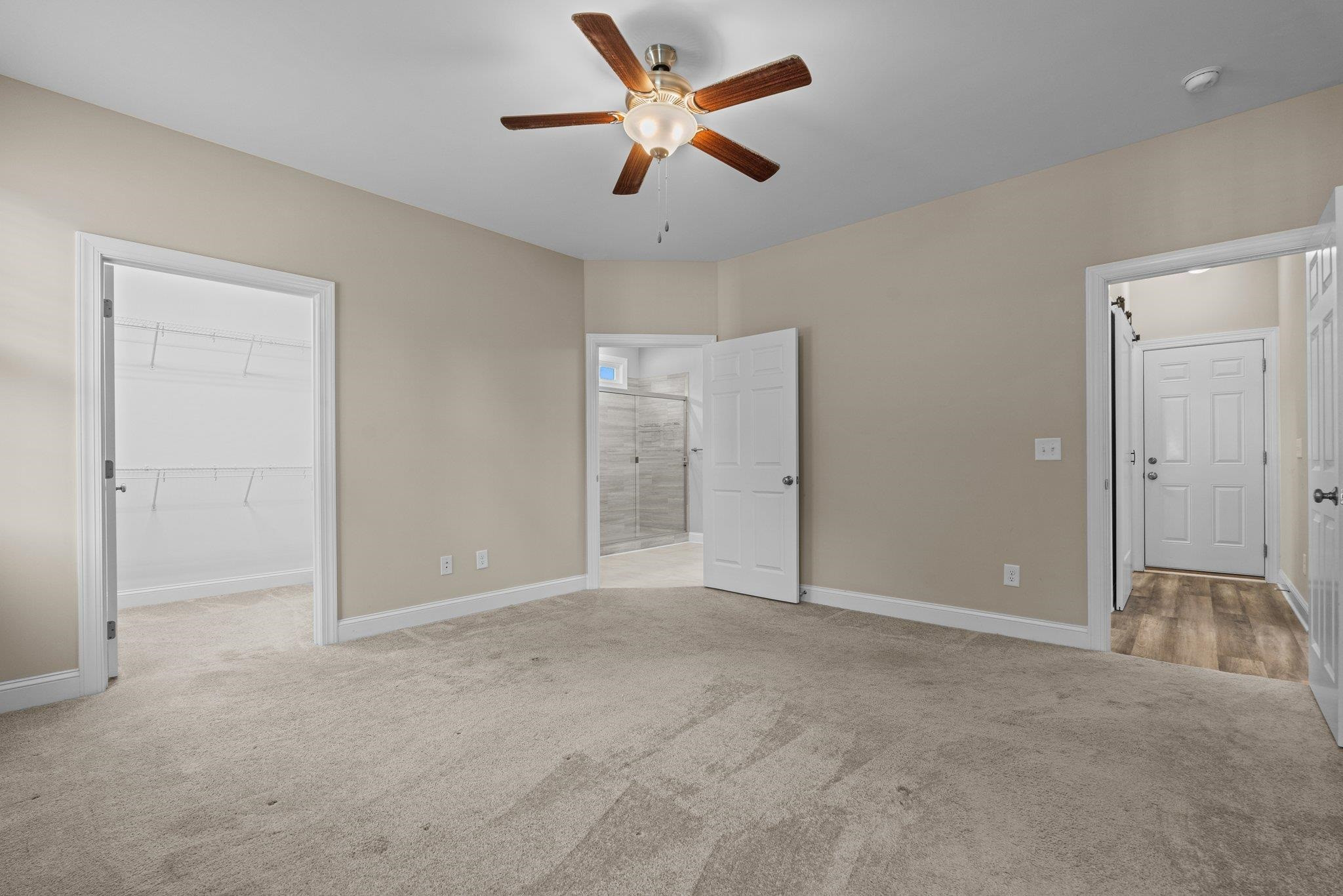991 Sheriff Johnson Road Lillington, NC 27546 - Photo 33 of 52 an empty room with closet and a chandelier fan