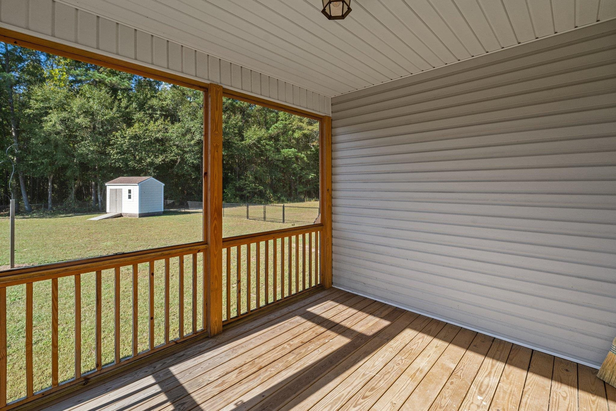 991 Sheriff Johnson Road Lillington, NC 27546 - Photo 40 of 52 a view of a balcony with wooden floor
