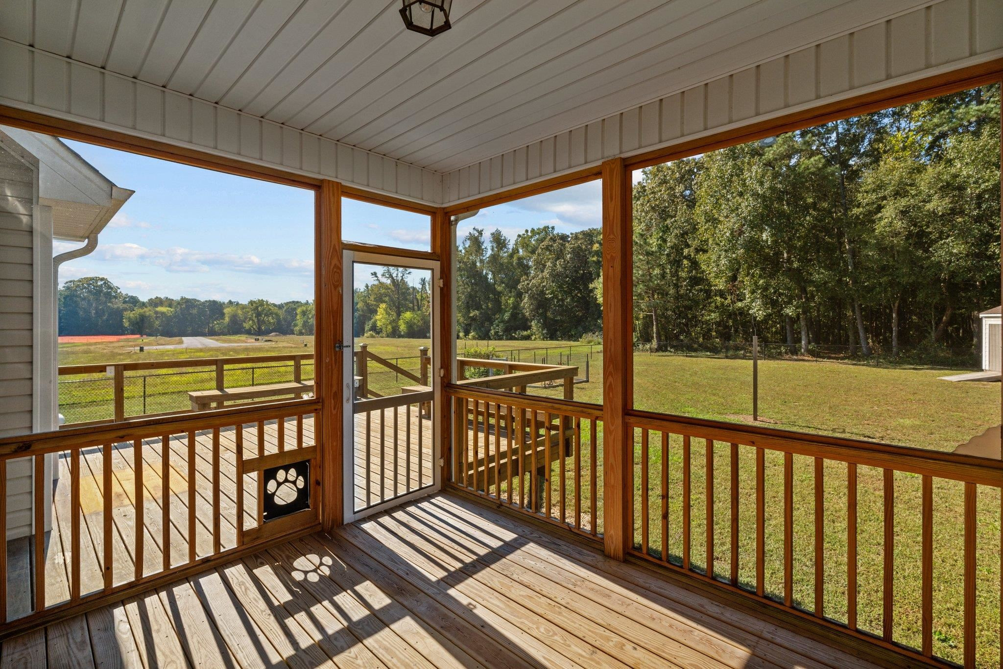 991 Sheriff Johnson Road Lillington, NC 27546 - Photo 41 of 52 a view of a balcony with wooden floor