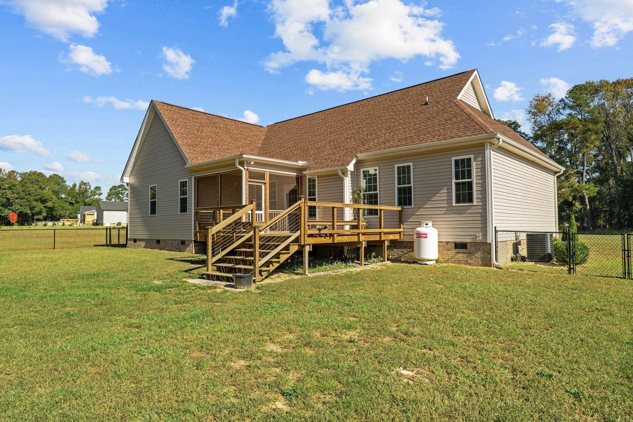 991 Sheriff Johnson Road Lillington, NC 27546 - Photo 44 of 52 a view of a house with a yard patio and swimming pool