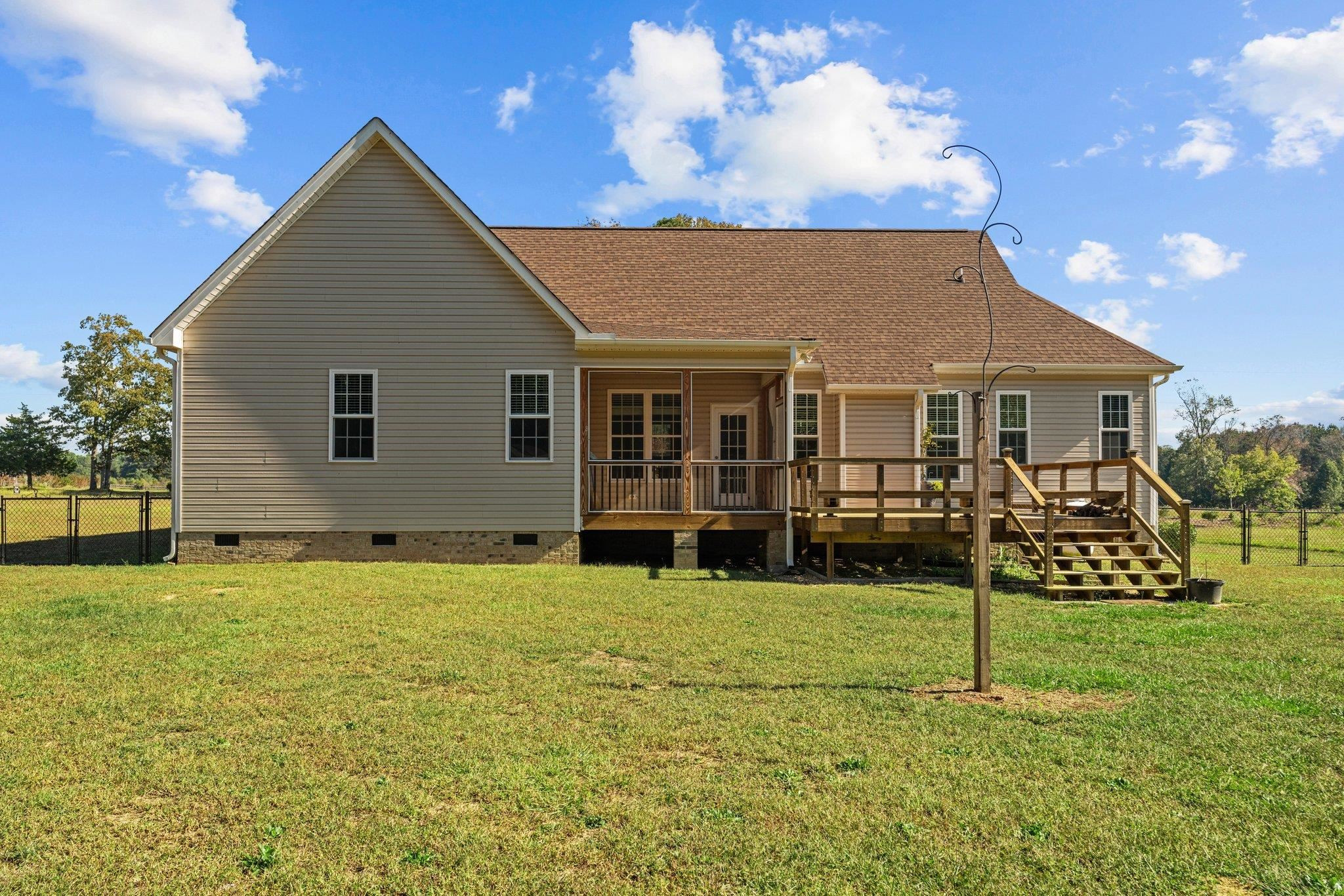991 Sheriff Johnson Road Lillington, NC 27546 - Photo 45 of 52 a view of a house with backyard porch and garden