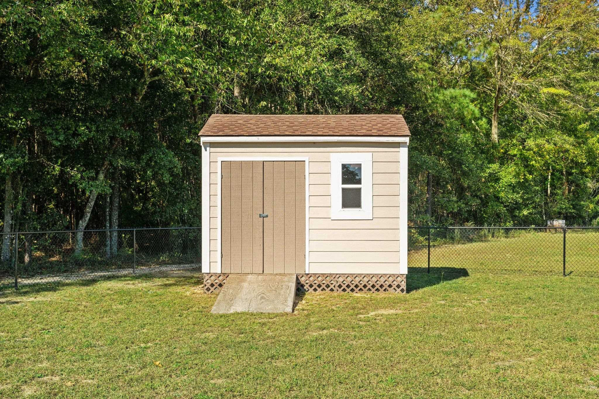 991 Sheriff Johnson Road Lillington, NC 27546 - Photo 49 of 52 a backyard of a house with lots of green space