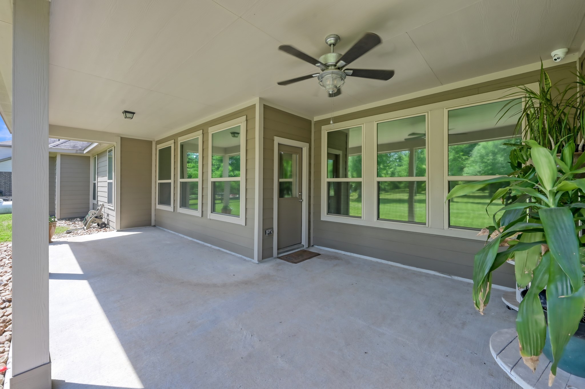 6264 Rolling Hills Road Conroe, TX 77303 - Photo 21 of 24 a view of a livingroom with a large window and wooden floor