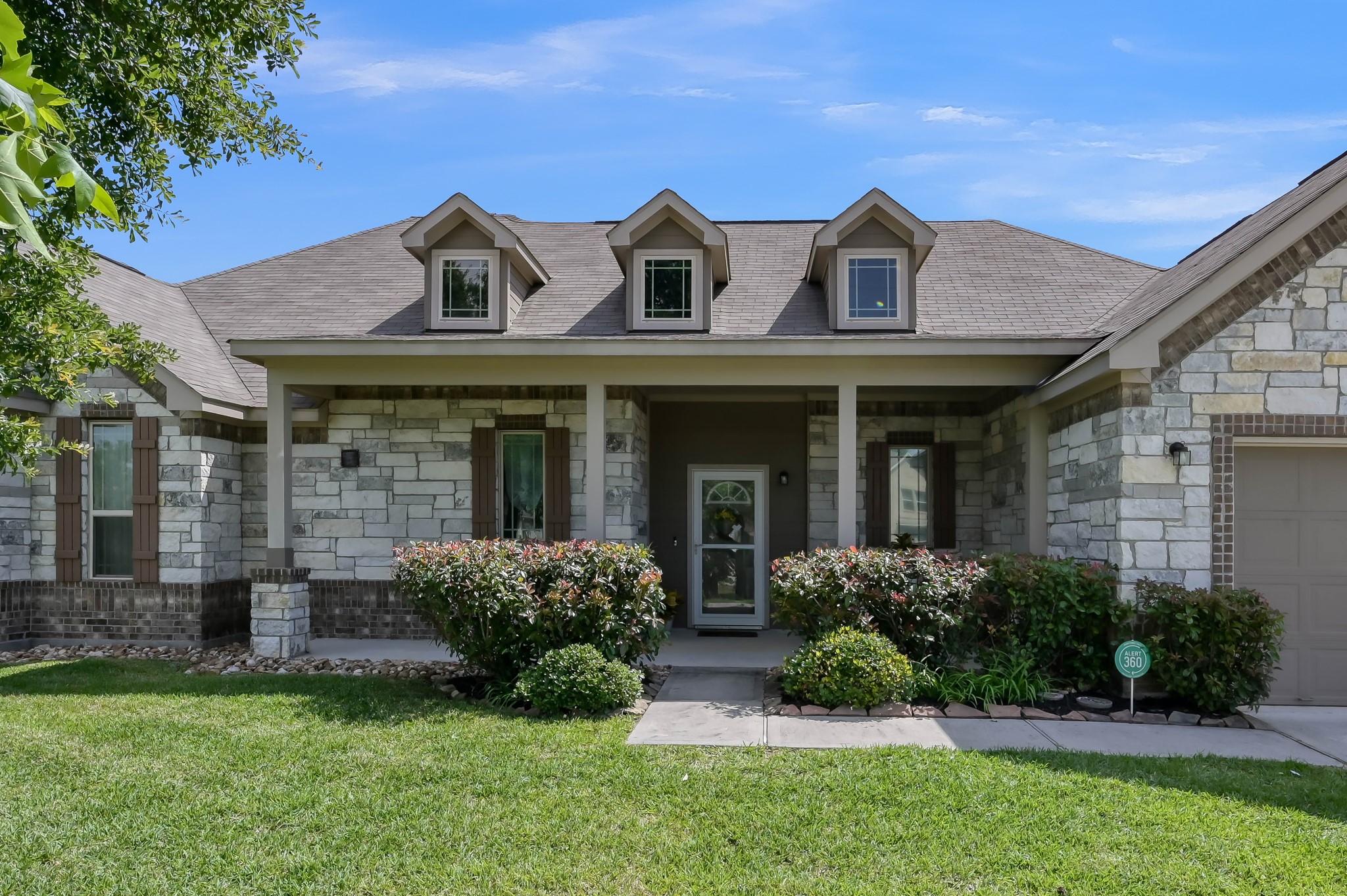 6264 Rolling Hills Road Conroe, TX 77303 - Photo 3 of 24 a front view of a house with a yard