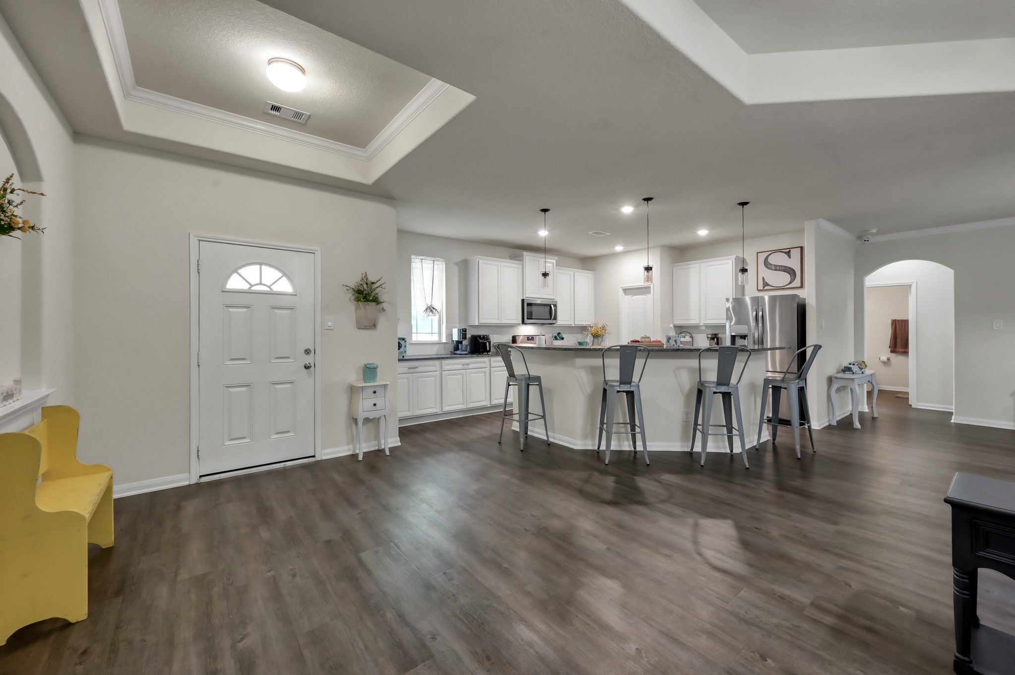 6264 Rolling Hills Road Conroe, TX 77303 - Photo 6 of 24 a living room with furniture and kitchen view