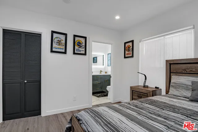 a bedroom with a bed and a walk in closet