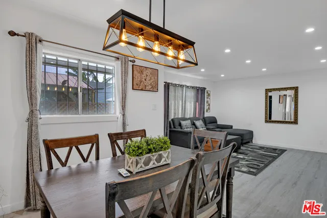 a bedroom with a bed and flat screen tv