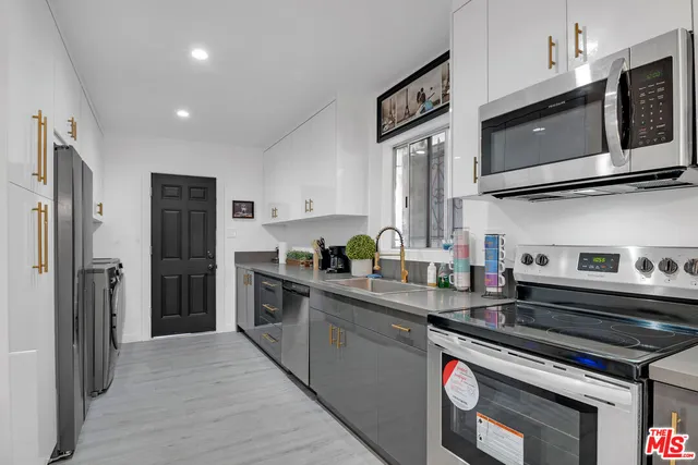 a bedroom with a bed and a night stand