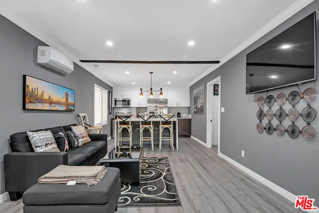 a dining room with furniture and entryway