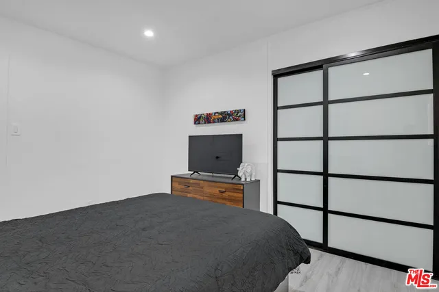 a kitchen with stainless steel appliances granite countertop a stove a microwave and a refrigerator