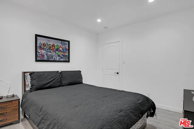 a view of wooden floor and windows in a room