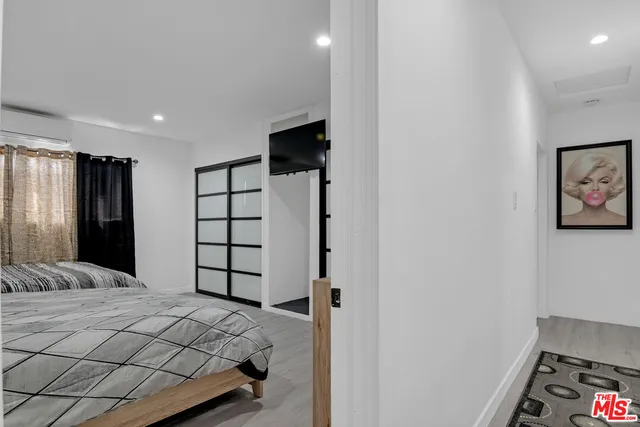 a bathroom with a granite countertop sink a toilet and shower